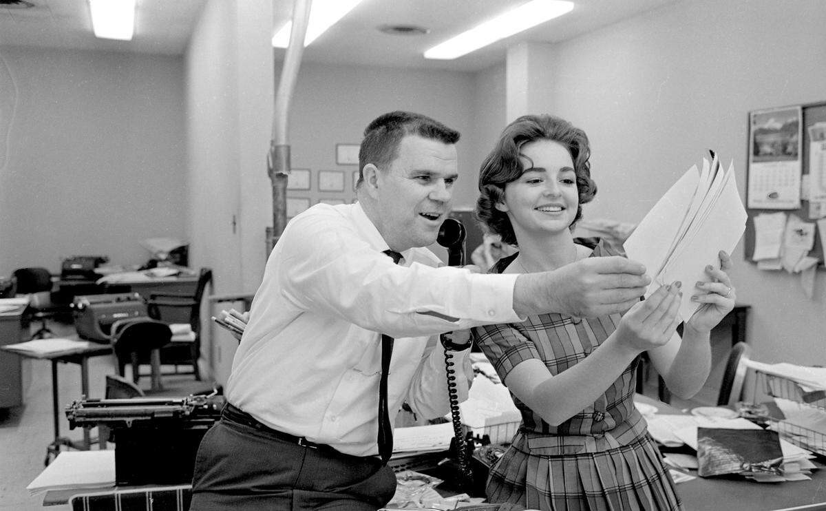 Raleigh Times Editor A.C. Snow working in the newsroom. From State Archives