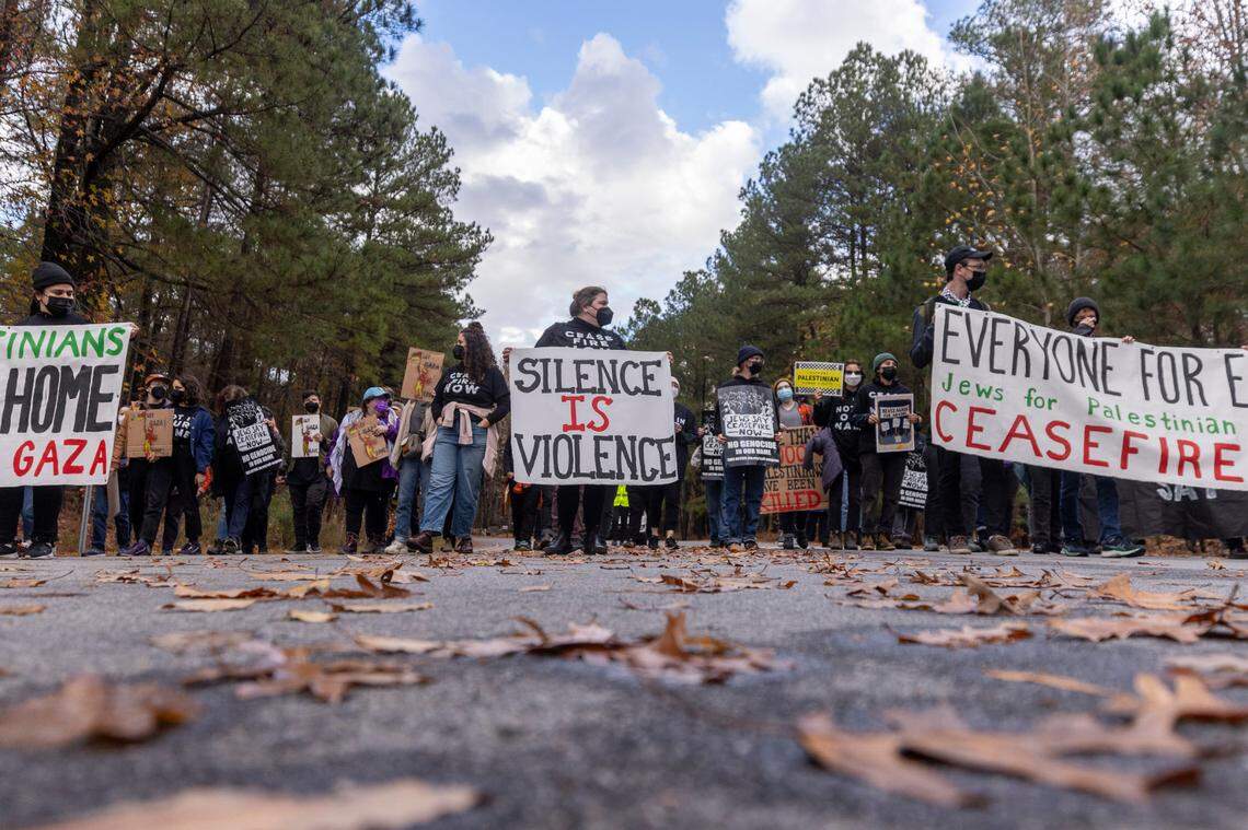 A group of demonstrators organized by Jewish Voice for Peace march from Umstead State Park to the North Harrison Avenue overpass over Interstate 40 where they held signs and banners on both sides of the overpass Wednesday afternoon, Nov. 22, 2023. The demonstrators were calling for a cease-fire in Gaza.