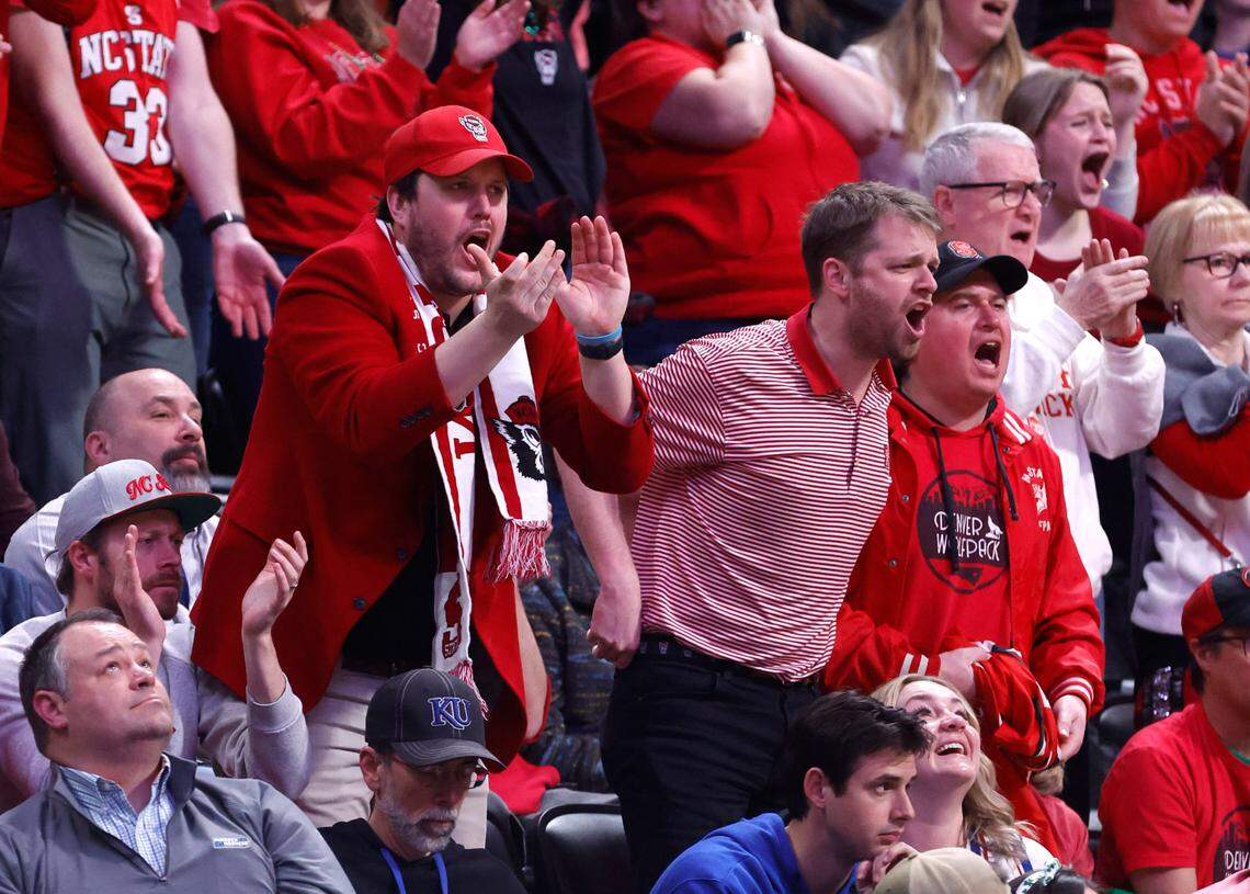 Fans cheer the Wolfpack during the first half of N.C. State’s game against Creighton in the first round of the NCAA Tournament at Ball Arena in Denver, Colo., Friday, March 17, 2023.