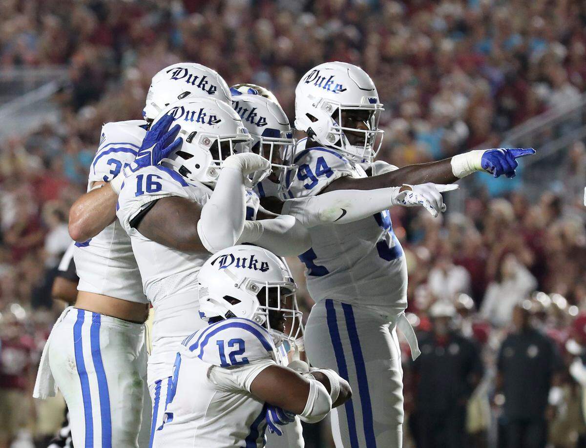 Duke players celebrate in the endzone following an interception that resulted in a touchdown in the first half of the Blue Devils’ game against Florida State on Saturday, Oct. 21, 2023, in Tallahassee, Fla.