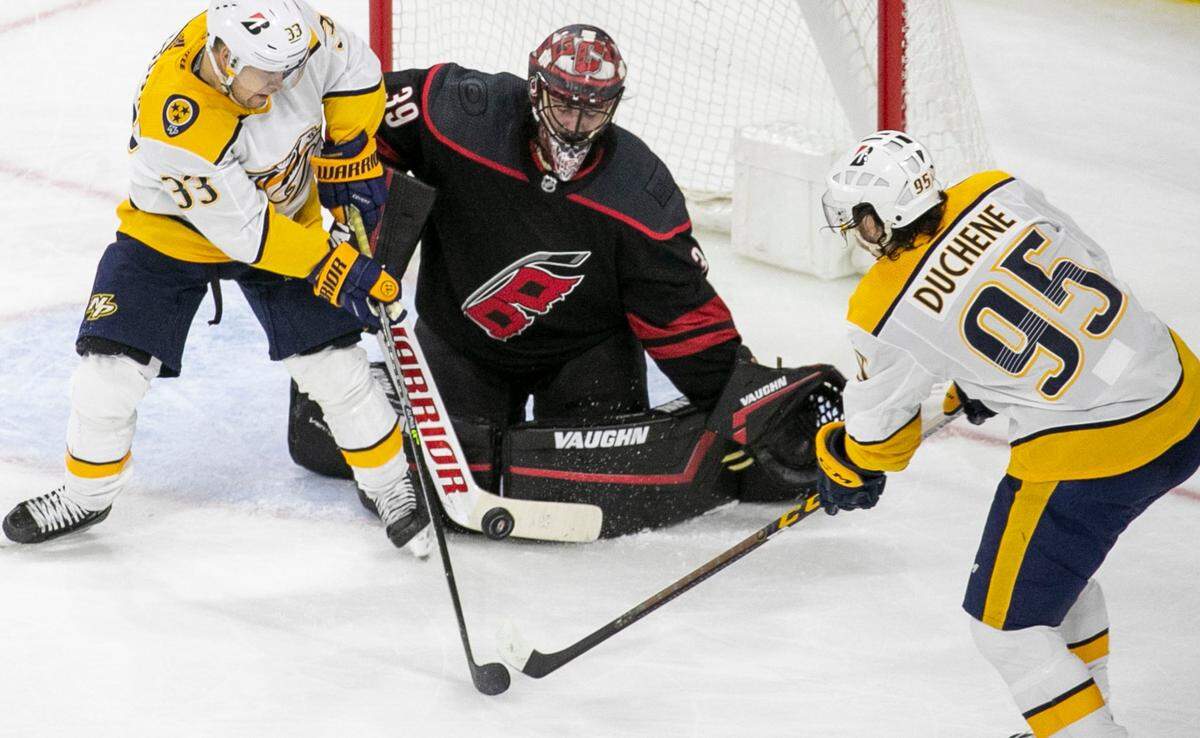 Carolina Hurricanes’ goalie Alex Nedeljkovic (39) stops a shot by Nashville’s Viktor Arvidsson (33) in the third period during game two of their first round Stanley Cup playoff series on Wednesday, May 19, 2021 at PNC Arena in Raleigh, N.C. Nedeljkovic had 32 saves in Hurricanes’ 3-0 victory.