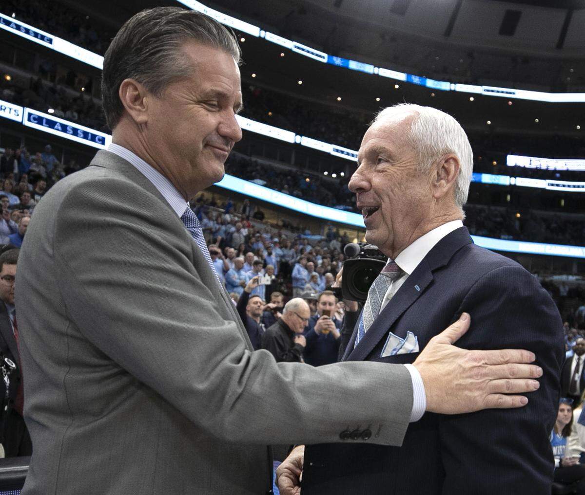 Kentucky coach John Calipari embraces North Carolina coach Roy Williams prior to their game during the 2018 CBS Sports Classic on Saturday, December 22, 2018 at United Center in Chicago, Illinois.