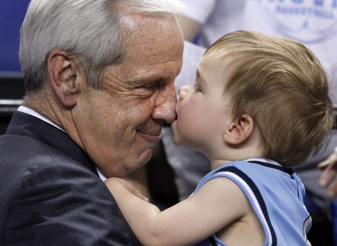 UNC’s Roy Williams plays with his grandson Court Williams, 18 months, after UNC’s 79-76 victory over Maryland in the semifinals of the ACC Men’s Basketball Tournament at the Greensboro Coliseum Saturday, March 16, 2013.
