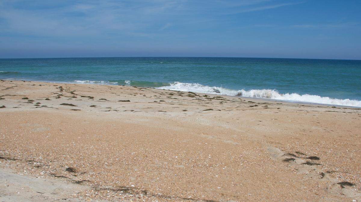 A man found unconscious on a North Carolina beach died in a surfing accident, Kure Beach police say.