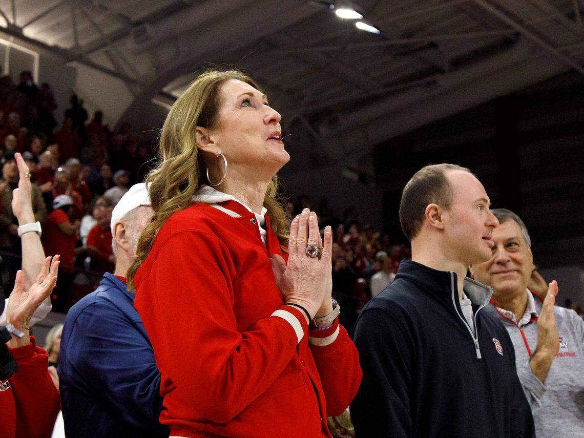 Debbie Antonelli, broadcaster and former N.C. State women’s basketball player, watches as her banner is raised to the rafters during a halftime ceremony of the Wolfpack’s game against Pittsburgh on Thursday, Jan. 16, 2025, at Reynolds Coliseum in Raleigh, N.C. The Wolfpack added Antonelli to its women’s basketball Ring of Honor for her playing career, broadcast career and philanthropic contributions to the program.