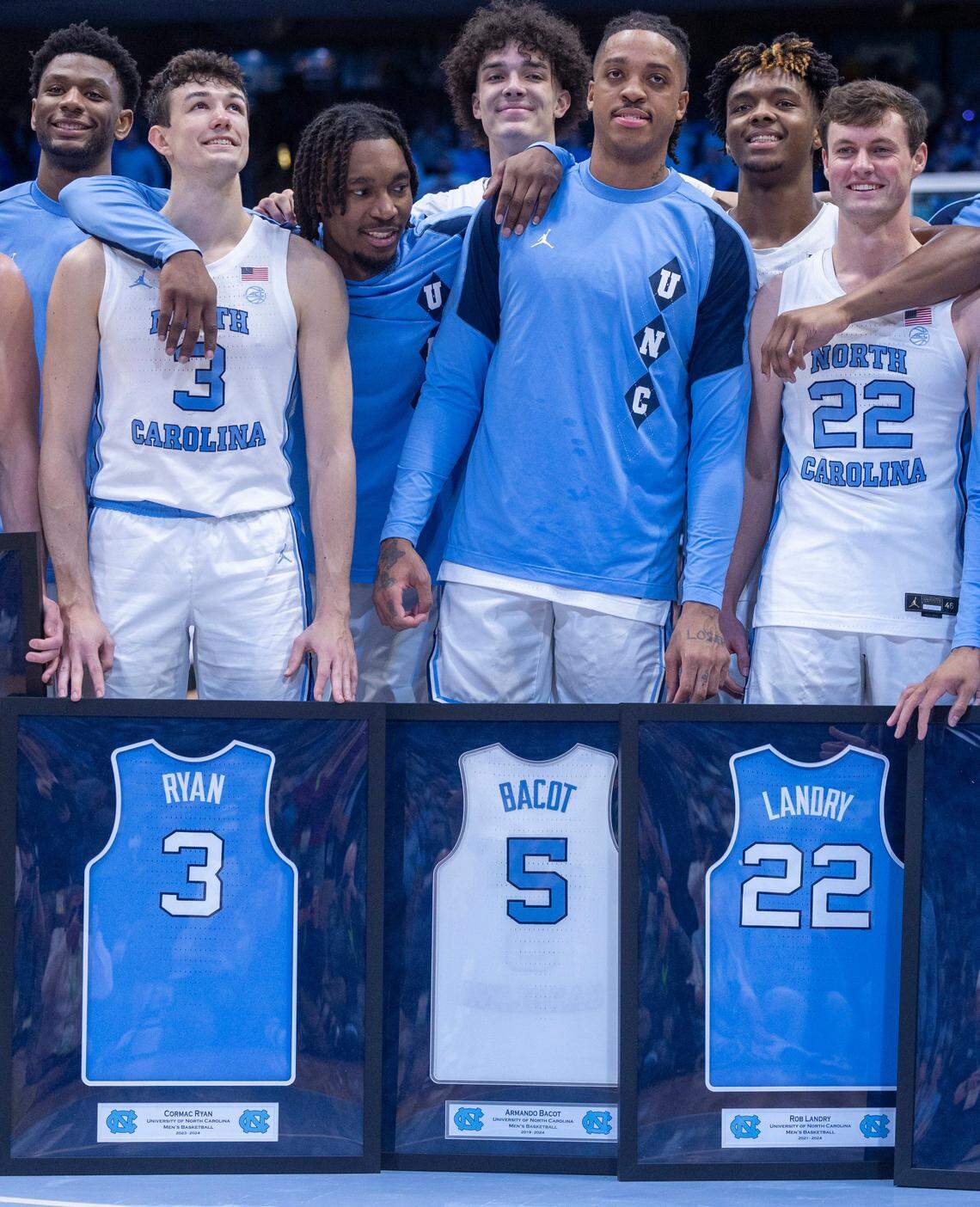 North Carolina’s Armando Bacot (5) is surrounded by teammates as he and other seniors including Cormac Ryan and Rob Landry (22) are honored prior to their final home game against Notre Dame on Tuesday, March 5, 2023 at the Smith Center in Chapel Hill, N.C.