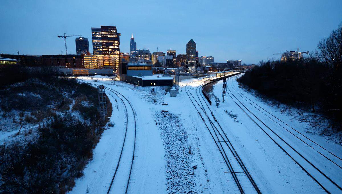 A snowy downtown Raleigh is seen from the Boylan Avenue bridge Wednesday morning, Jan. 22, 2025.