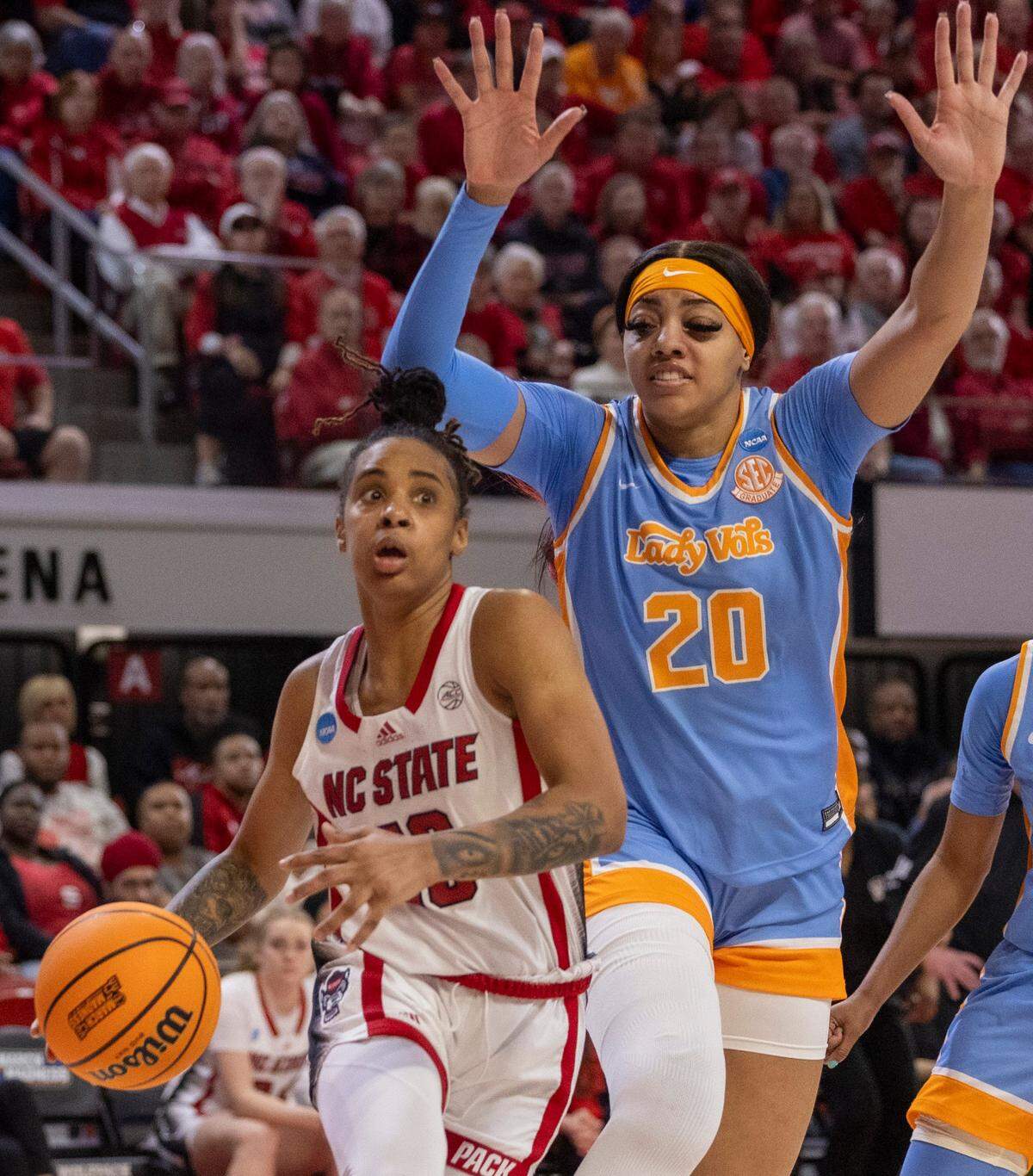 NC State’s Aziaha James (10) drives to the basket as Tennessee’s Tamari Key (20) defends during the second half of the second round of the Division I Women’s Basketball Championship at Reynolds Coliseum in Raleigh, on March 25, 2024. The Wolfpack won 79-72.