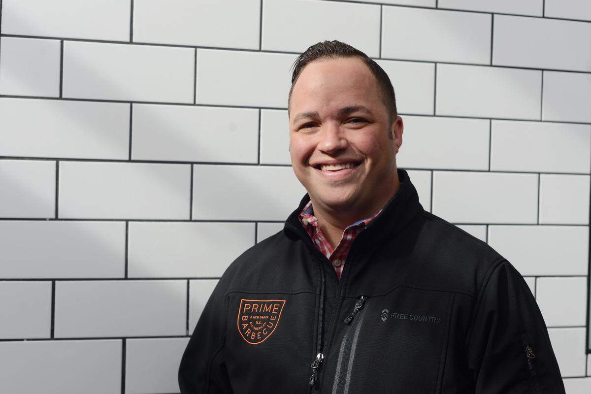 Chris Prieto opened Prime BBQ in 2020 at the beginning of the pandemic. His restaurant had a successful first year, often selling out of meat and recently winning praise from a top Texas barbecue writer. Prieto poses for a photo in his dining room in January 2020.