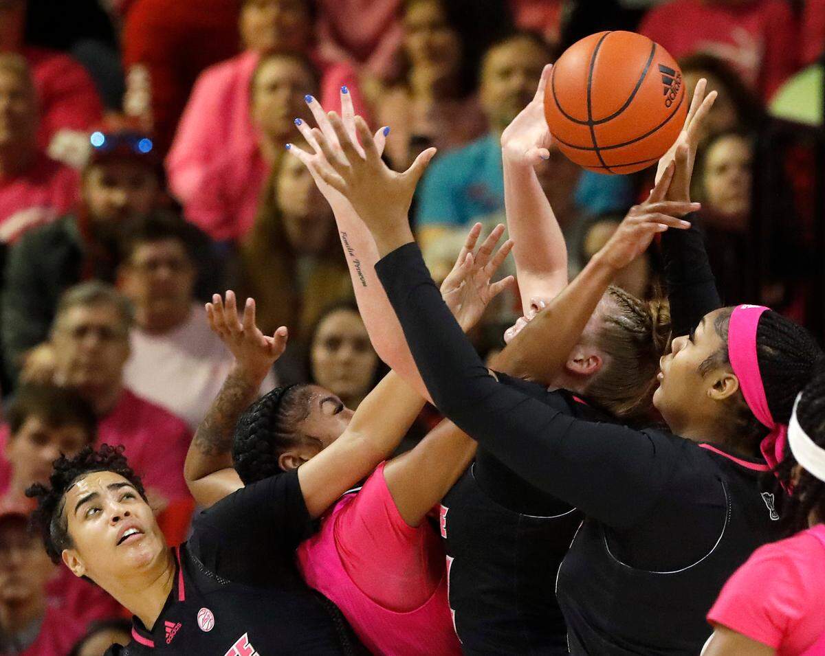 N.C. State’s Madison Hayes, Laci Steele and Mallory Collier battle for a rebound with Louisville’s Nyla Harris during the first half of the Wolfpack’s 77-67 win on Monday, Feb. 5, 2024, at Reynolds Coliseum in Raleigh, N.C.