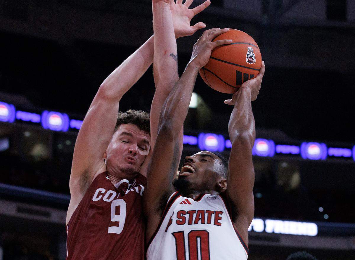 N.C. State’s Marcus Hill drives to the basket against Colgate’s Cameron Brennan during the second half of the Wolfpack’s 72-49 win at Lenovo Center on Monday, Nov. 18, 2024, in Raleigh, N.C.