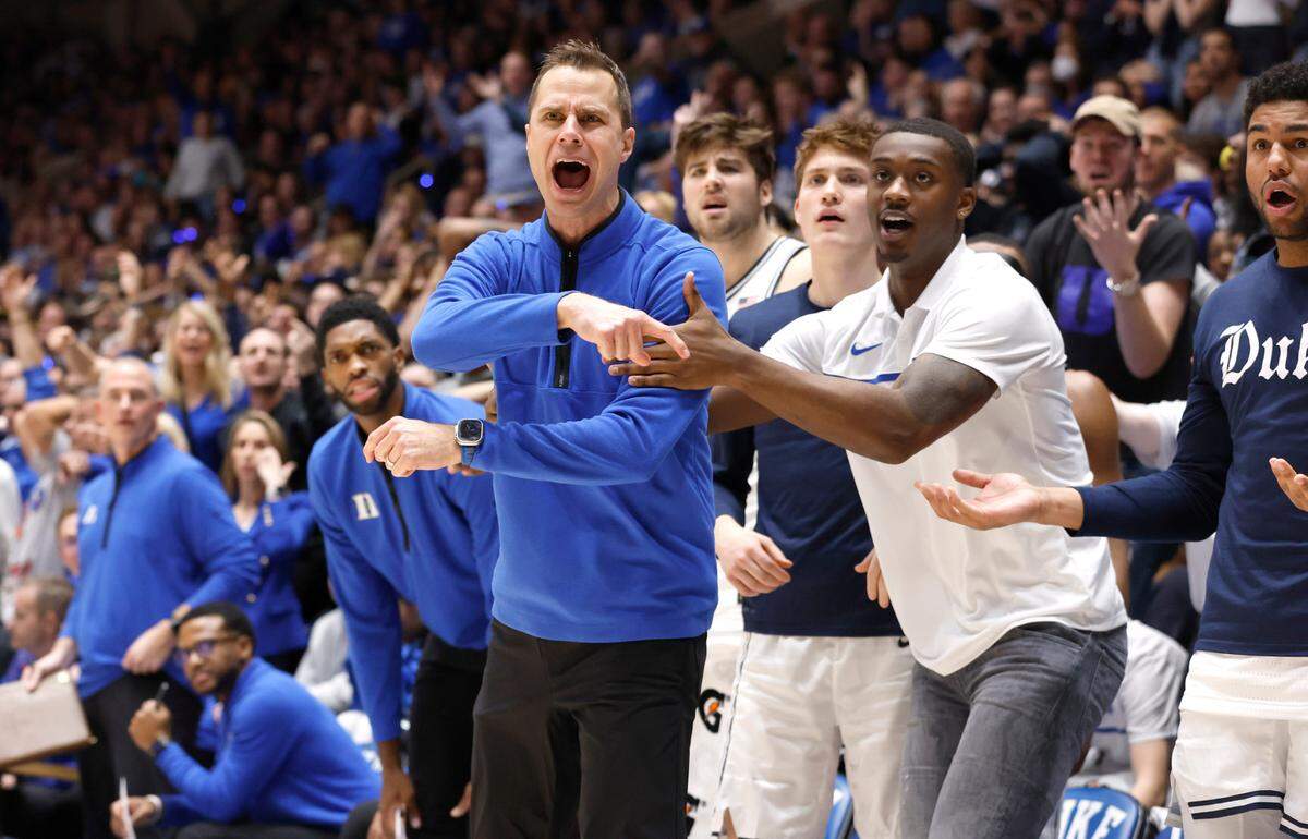 Duke’s Dariq Whitehead holds back head coach Jon Scheyer as he yells at the officials during the second half of Duke’s 63-57 victory over UNC at Cameron Indoor Stadium in Durham, N.C., Saturday, Feb. 4, 2023.