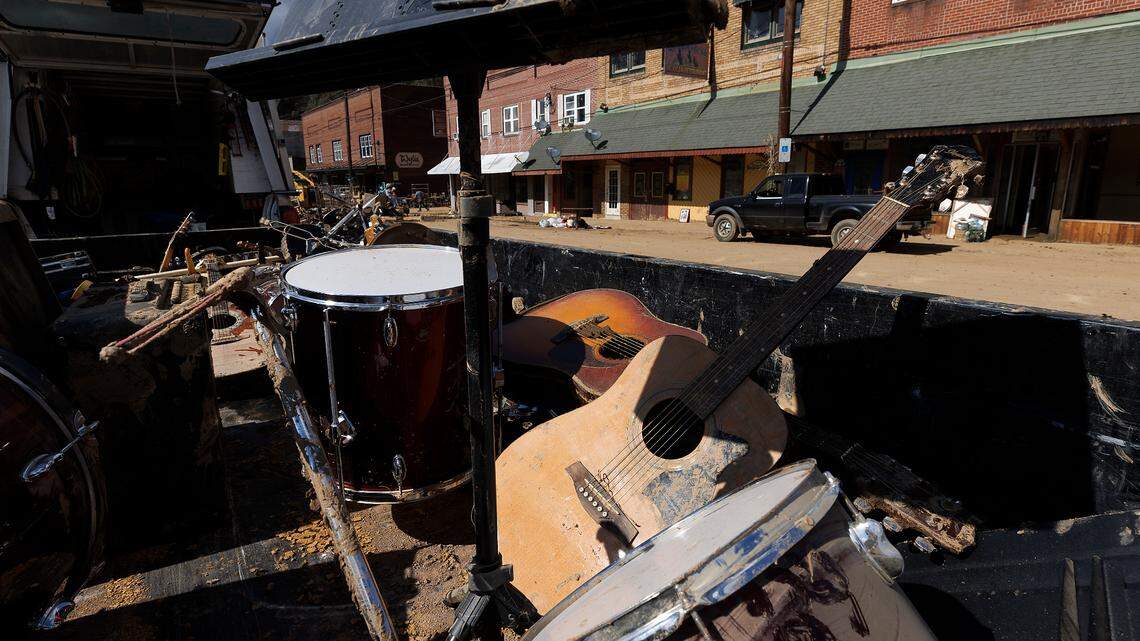 Mud-splattered instruments sit in the back of a truck as volunteers clear debris from Majestic Music in downtown Spruce Pine, N.C. on Thursday, Oct. 3, 2024, days after Hurricane Helene brought heavy flooding to the area.