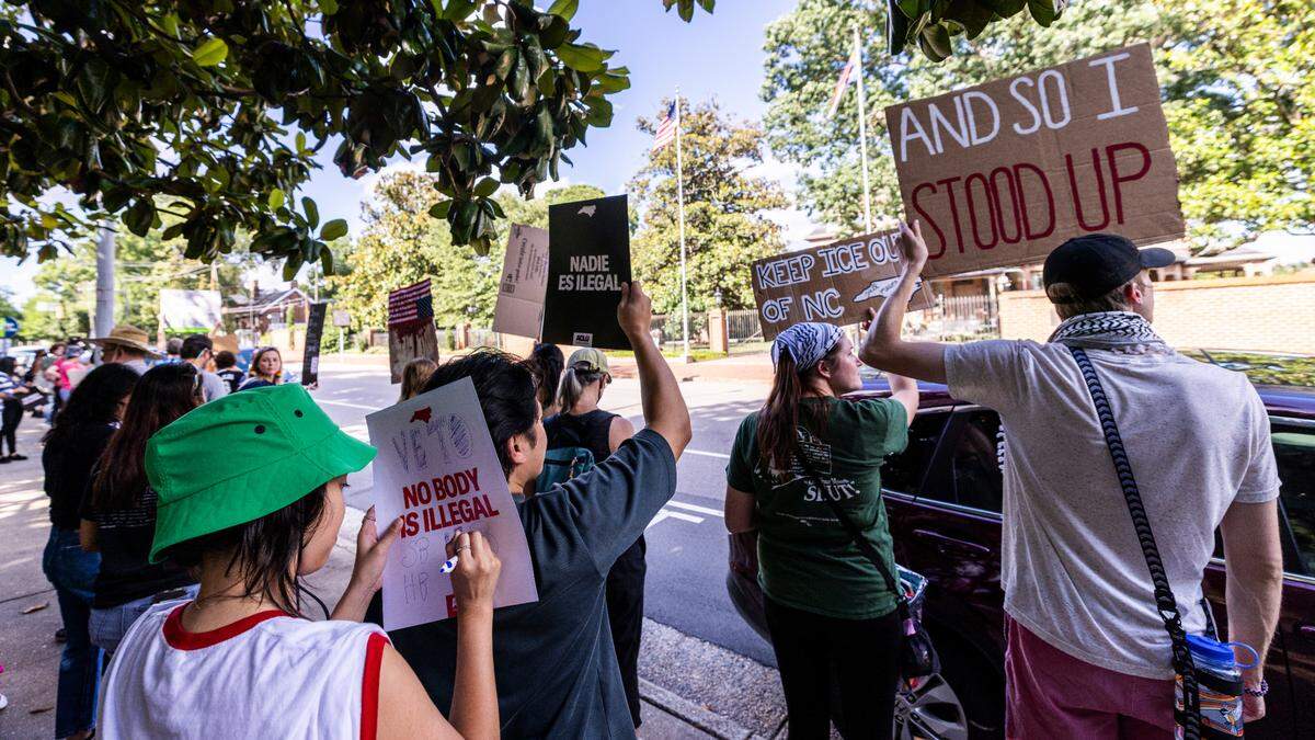 More than 100 demonstrators rallied outside the Executive Mansion in downtown Raleigh on Wednesday, June 18, 2025, urging Gov. Josh Stein to veto two GOP-backed bills that would expand state and local law enforcement cooperation with U.S. Immigration and Customs Enforcement.