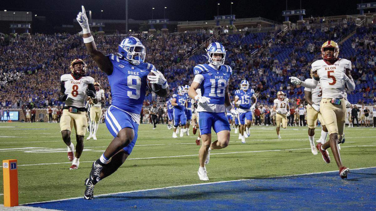 Duke’s Jaquez Moore celebrates as he scores a touchdown during the first half of the Blue Devils’ season opener against Elon on Thursday, Aug. 28, 2025, at Wallace Wade Stadium in Durham, N.C.
