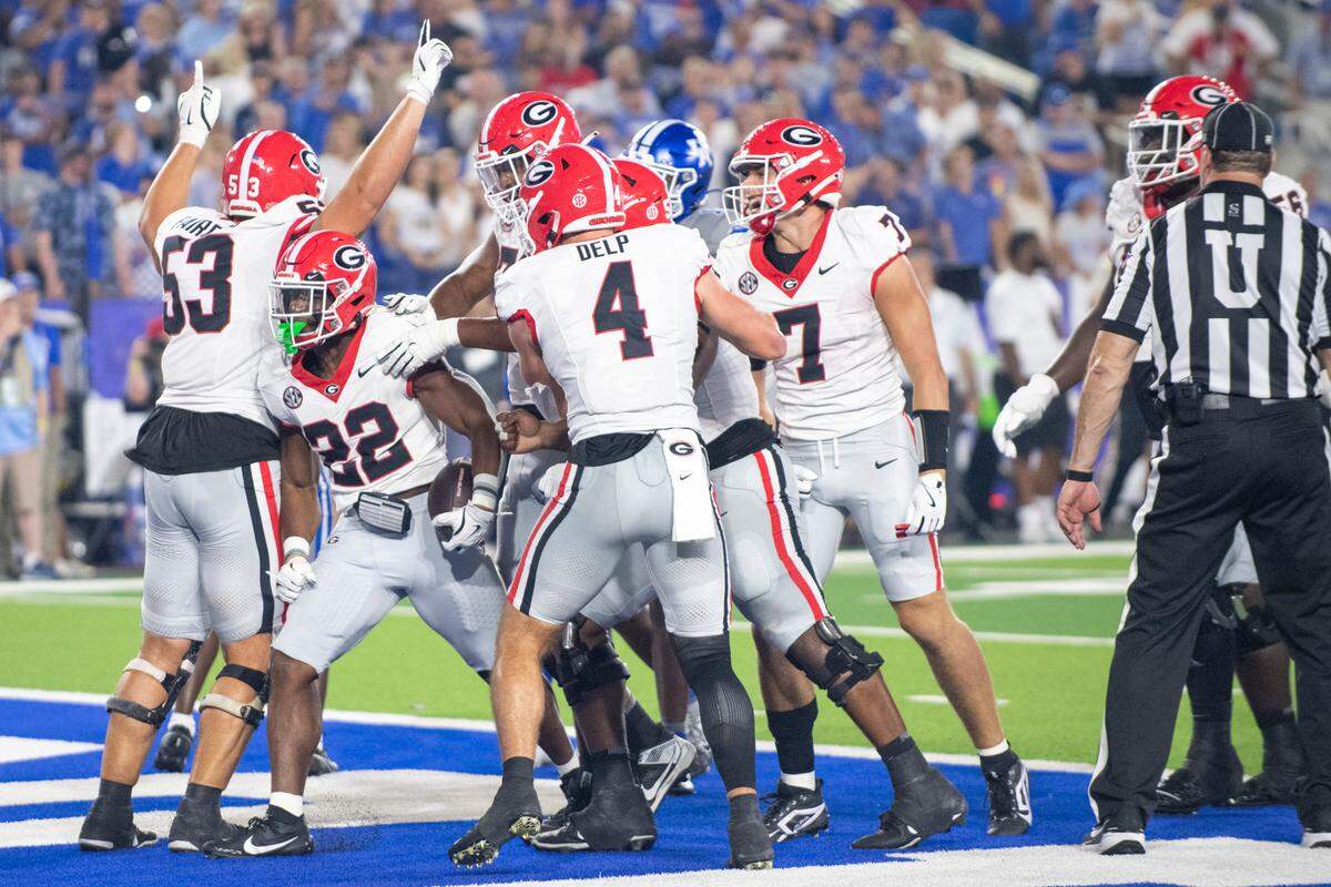 Sep 14, 2024; Lexington, Kentucky, USA; Georgia Bulldogs running back Branson Robinson (22) celebrates with teammates after he scores a touchdown during the fourth quarter against the Kentucky Wildcats at Kroger Field.