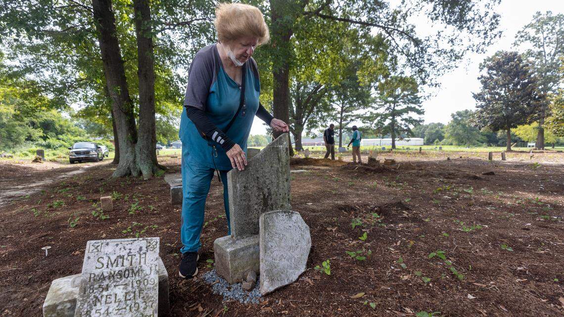 Joy Williams works in the Wilkins Cemetery, one of the oldest African-American cemeteries in Harnett County, helping to restore and document the buried on Wednesday, August 24, 2022 in Dunn, N.C.