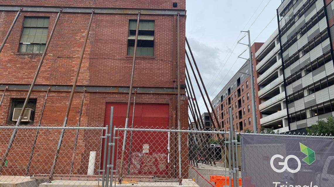 Workers have braced the walls of the former Dillon Supply Co. building on West Street in downtown Raleigh. Most of the building has been demolished, but these walls will be incorporated into Union West, a high-rise apartment complex being built next to Raleigh Union Station.