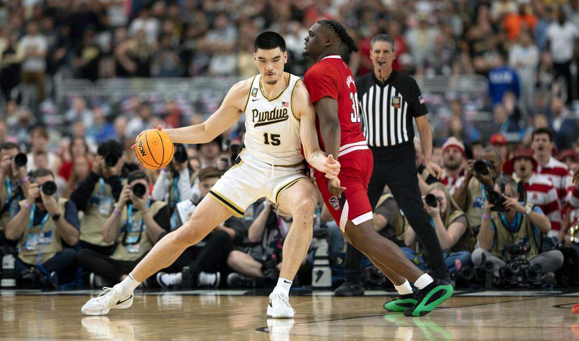 Purdue’s Zach Edey (15) post up against N.C. State’s D.J. Burns Jr. (30) during the first half in the NCAA Final Four National Semifinal game on Saturday, April 6, 2024 at State Farm Stadium in Glendale, AZ.