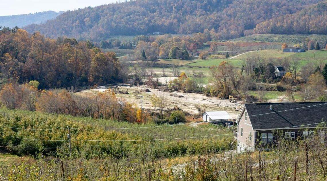 Jerred Nix, a Henderson County apple farmer, described having three feet of sand on top of this 10-acre field. N.C. Agricultural Commissioner Steve Troxler said estimates show Helene caused more than $900 million worth of agricultural damage.