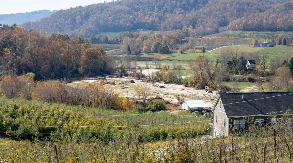 Jerred Nix, a Henderson County apple farmer, described having three feet of sand on top of this 10-acre field. N.C. Agricultural Commissioner Steve Troxler said estimates show Helene caused more than $900 million worth of agricultural damage.