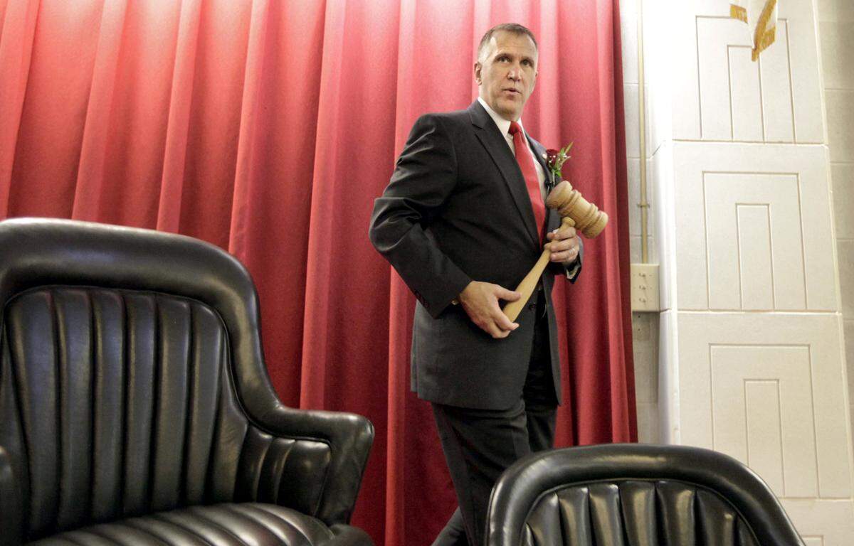 House Speaker Thom Tillis, a Republican from Mecklenburg County, steps from the podium after closing the legislature's first day in session in 2011.