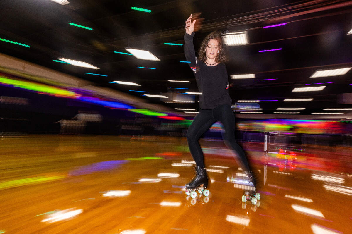 A roller-skater circles the rink at Wheels Durham roller-skating rink on Hoover Road Friday, Feb. 28, 2025 after having been closed in 2020 after four decades. In 2021, the city bought the space and began renovations after residents demanded the return of the safe space for youth in East Durham.