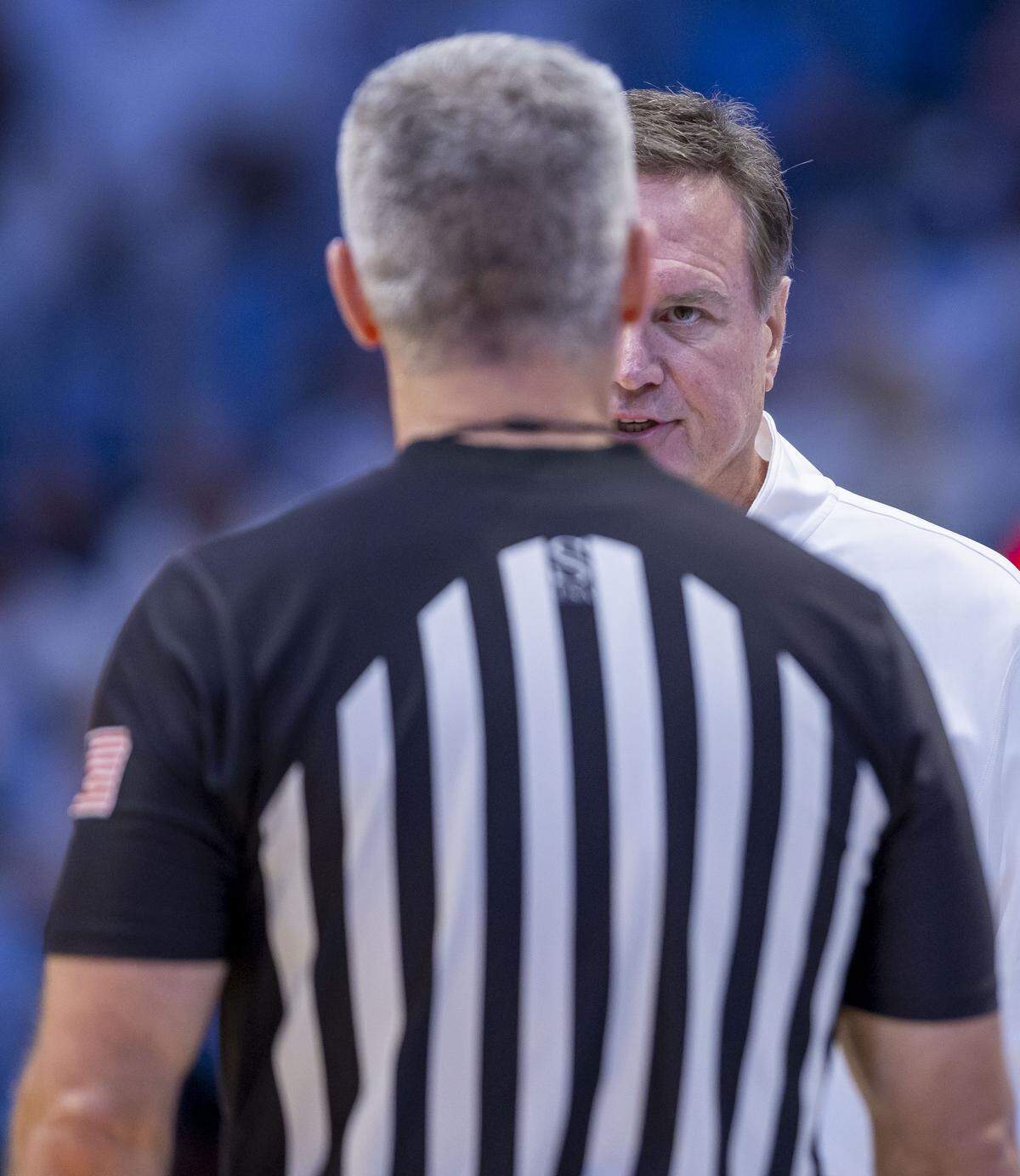 Kansas coach Bill Self stares down official Ron Groover after a call against the Jayhawks in the first half against North Carolina on Friday, November 7, 2025 at the Smith Center in Chapel Hill, N.C.