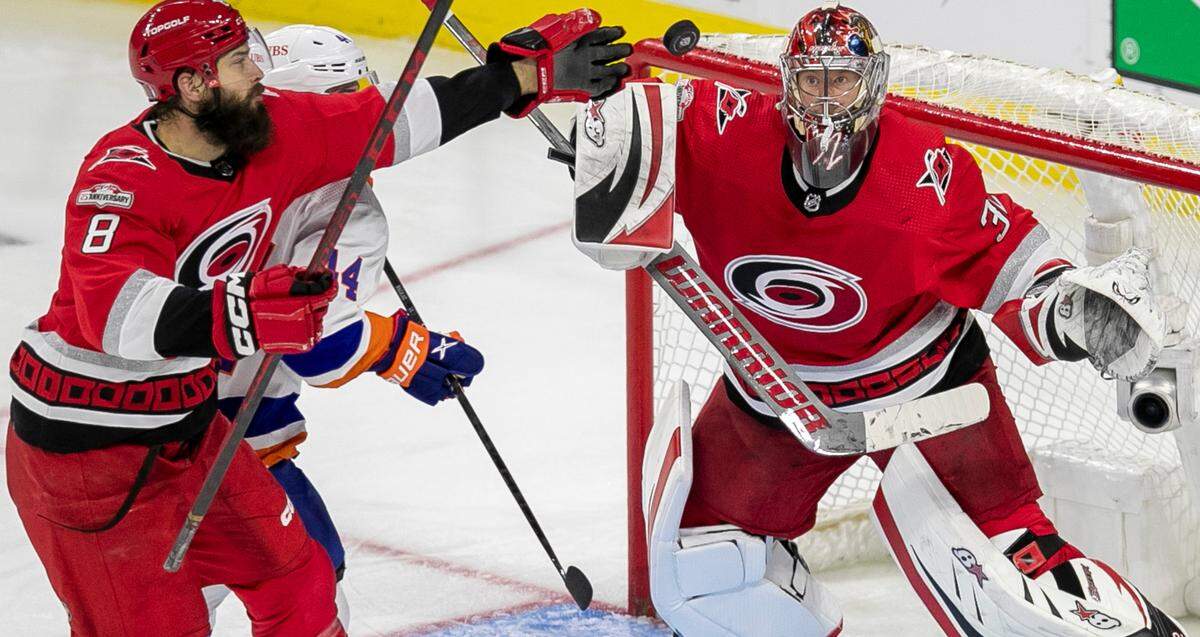 The Carolina Hurricanes Brent Burns (8) reaches for the puck in front of goalie Antii Raanta (32) in the third period during Game 5 of their Stanley Cup series on Tuesday, April 25, 2023 at PNC Arena in Raleigh, N.C. 
