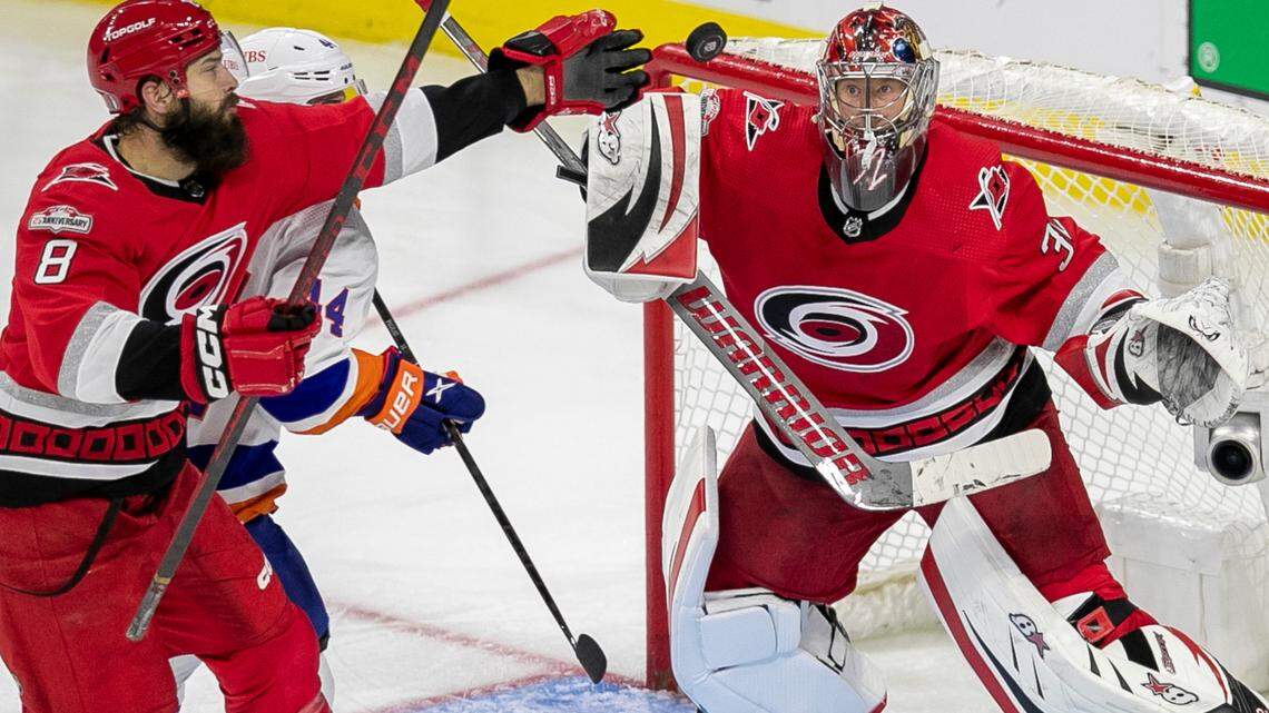 The Carolina Hurricanes Brent Burns (8) reaches for the puck in front of goalie Antii Raanta (32) in the third period during Game 5 of their Stanley Cup series on Tuesday, April 25, 2023 at PNC Arena in Raleigh, N.C.
