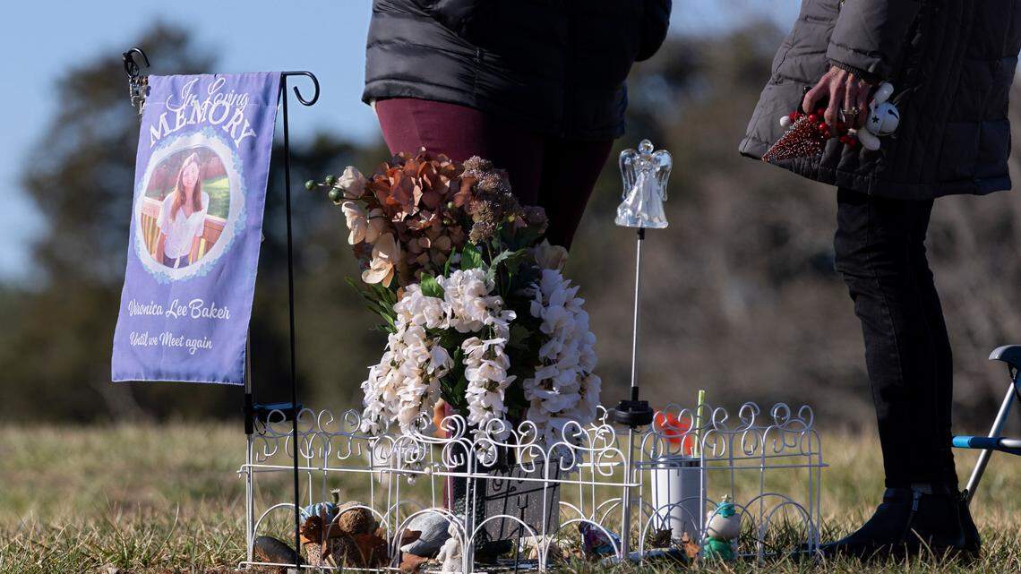 Marisa Snell and Laura S. Baker visit the grave of Veronica Baker on Monday, Jan. 9, 2023, in Raleigh, N.C. Veronica Baker was fatally shot in August 2020.