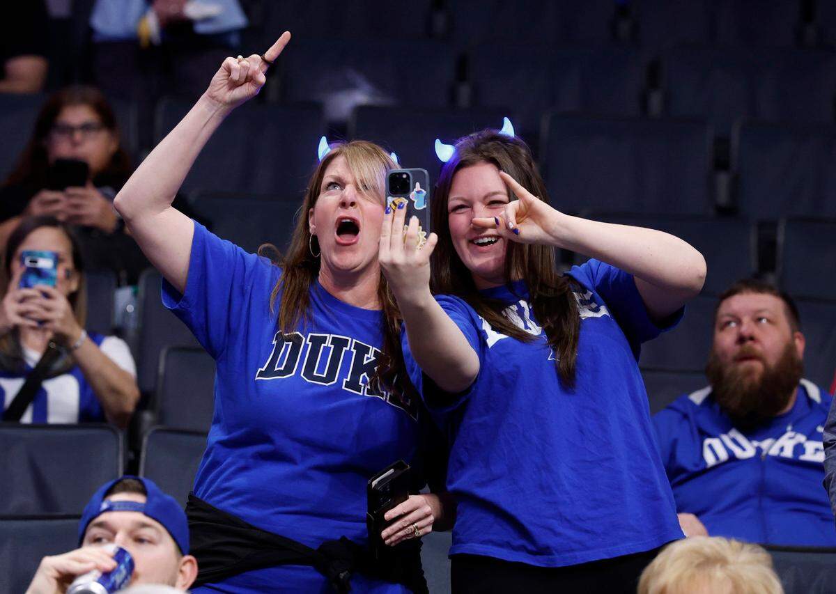 Kate Norton, left, and her daughter Anna cheer on the Blue Devils before Duke’s game against Georgia Tech in the quarterfinals of the 2025 ACC Men’s Basketball Tournament at the Spectrum Center in Charlotte, N.C., Thursday, March 13, 2025.