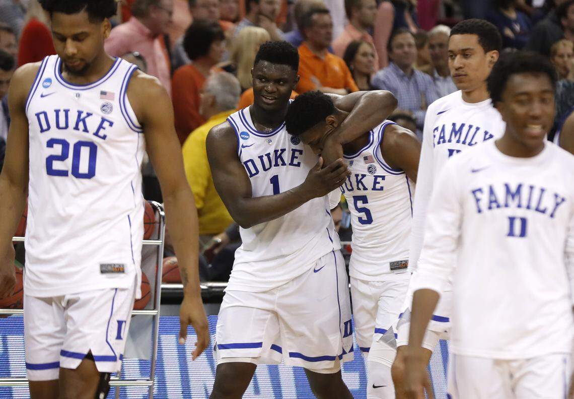 Duke’s Zion Williamson (1) walks off the court with RJ Barrett (5) after Duke’s 77-76 victory over UCF in the second round of the NCAA Men’s Basketball Championship in Columbia, S.C., Sunday, March 24, 2019.