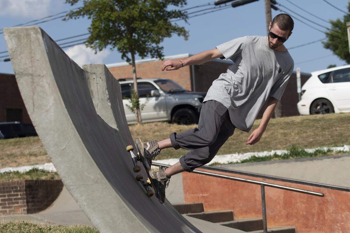 Ian Ellis, 21, of Charlotte, N.C., skateboards at the Durham Skate Park in Durham, N.C., on May 27, 2021. A mixed-use condominium will be constructed on Hunt Street next to the skate park. Durham City Council members have raised concerns about future residents calling the police about noise due to the condo’s proximity to Durham Central Park and the skate park.