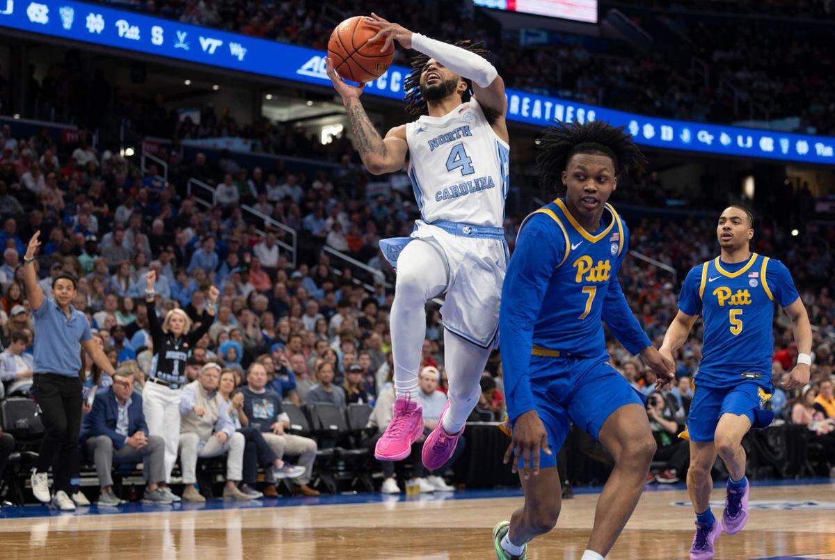 North Carolina’s R.J. Davis (4) drives to the basket against Pittsburgh’s Carlton Carrington (7) in the second half during the semi-finals of the ACC Men’s Basketball Tournament at Capitol One Arena on Friday, March 15, 2024 in Washington, D.C. Davis scored 25 points in the Tar Heels’ 72-65 victory.