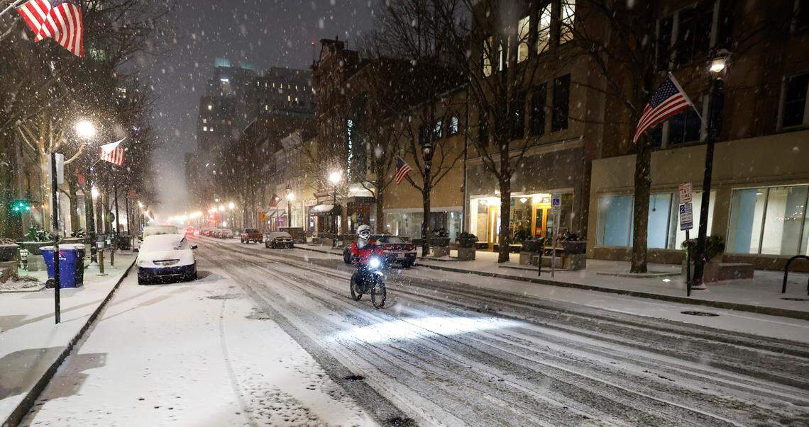 Snow falls on a quiet Fayetteville St. in downtown Raleigh, N.C., Tuesday evening, Jan. 21, 2025.