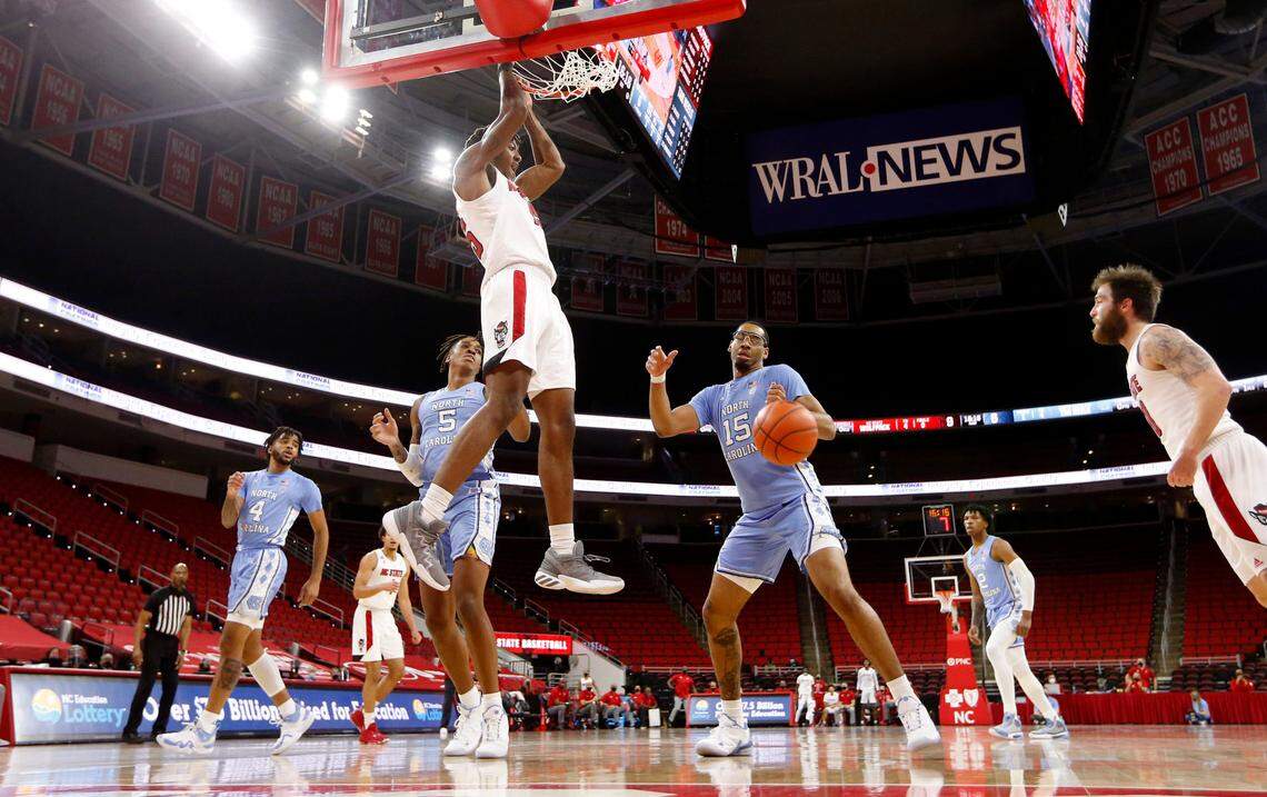 N.C. State’s Manny Bates (15) slams in two during N.C. State’s 79-76 victory over UNC at PNC Arena in Raleigh, N.C., Tuesday, December 22, 2020.