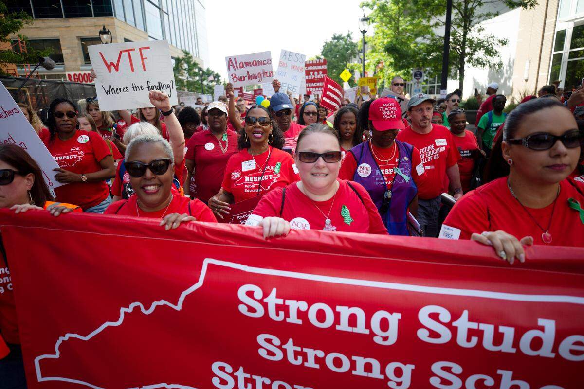 Thousands marched down Fayetteville St. in downtown Raleigh on Wednesday, May 1, 2019 to demand more funding from state lawmakers for public education.