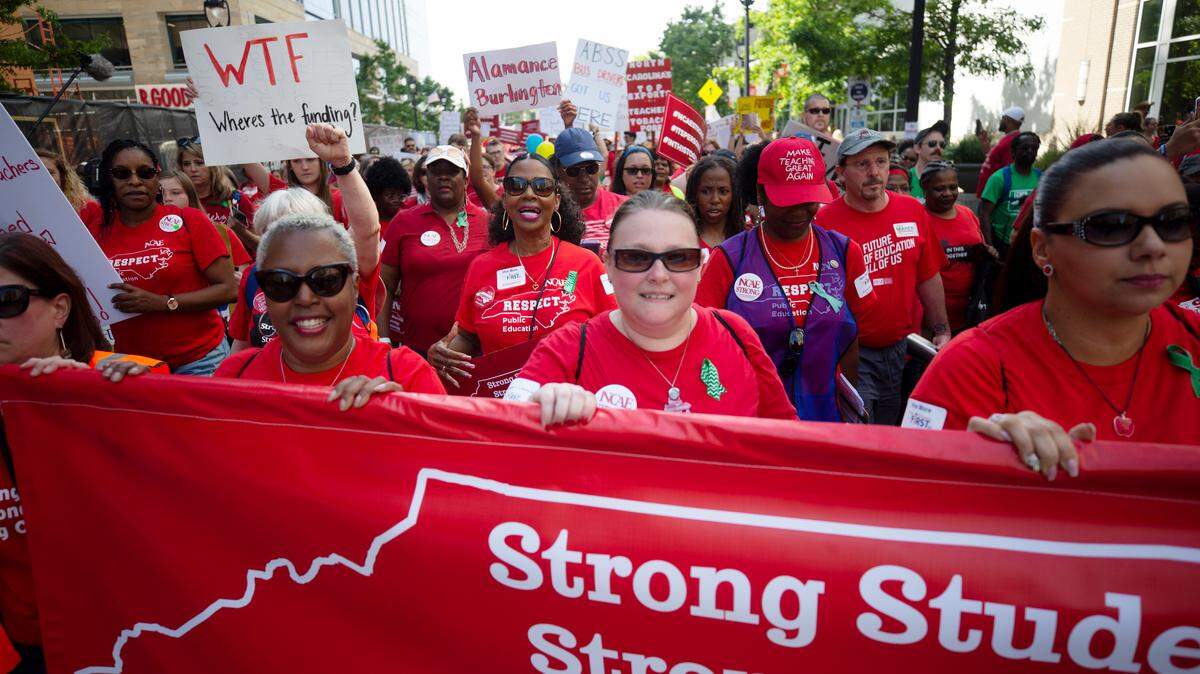 Thousands marched down Fayetteville St. in downtown Raleigh on May 1, 2019 in a rally organized by the North Carolina Association of Educators. NCAE has opposed a new model that calls for tying teacher pay to their perfomance.