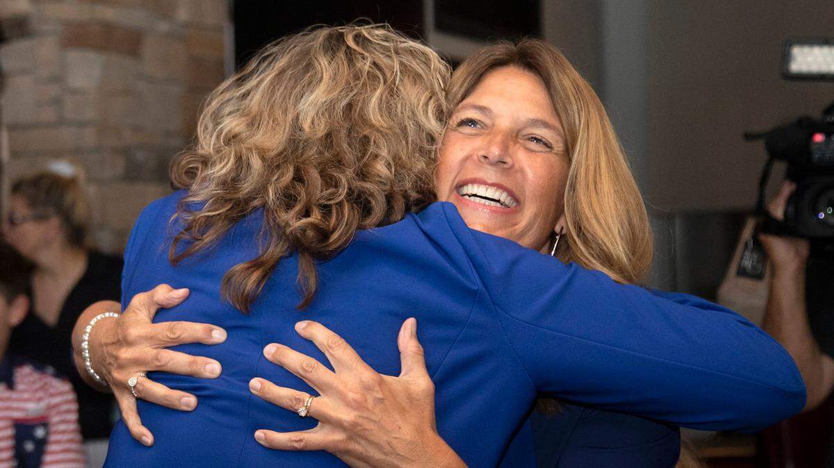Michele Morrow, Republican candidate for NC superintendent of public instruction, hugs Sandy Joiner at an election night watch party at Sophie’s Grill and Bar on Tuesday, Nov. 5, 2024, in Cary, N.C.