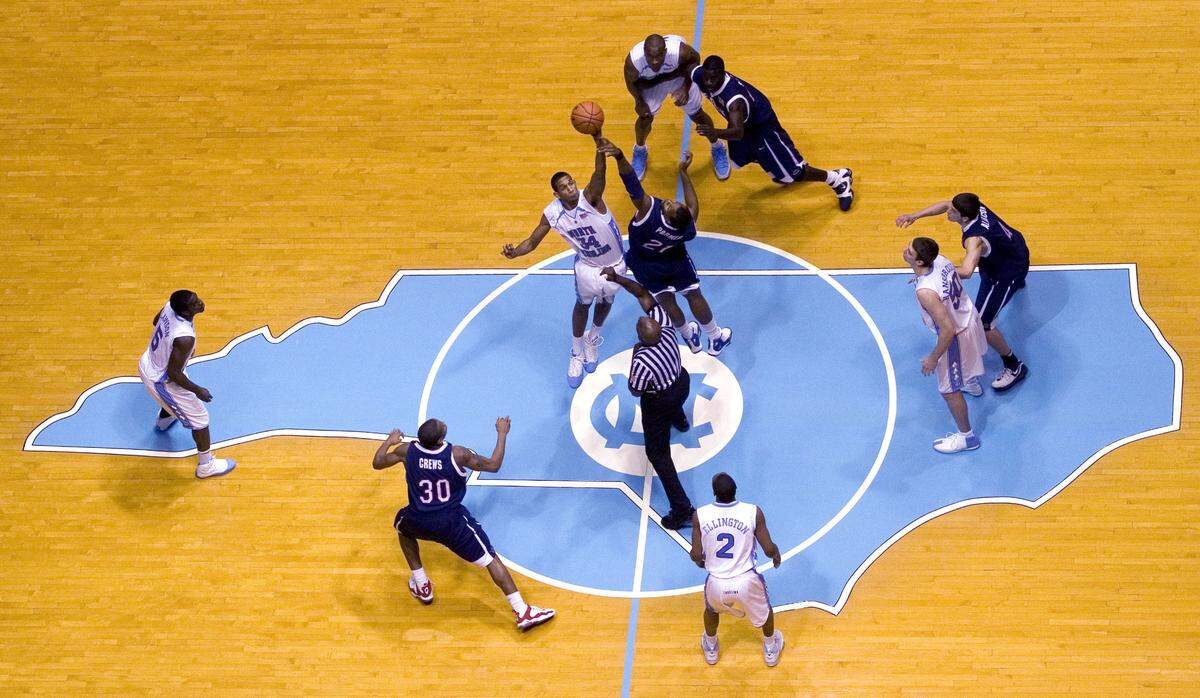 UNC’s Brandan Wright (34) controls the opening tip-off over Florida Atlantic’s Jeff Palmer (21) during their game in December 2006 in the Smith Center.
