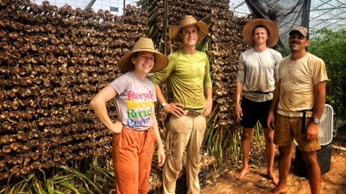 Vera Fabian and Gordon Jenkins (at left), co-owners of Ten Mothers Farm, started their community-supported agriculture business with the goal of paying their employees a living wage. They later became certified through Orange County Living Wage.