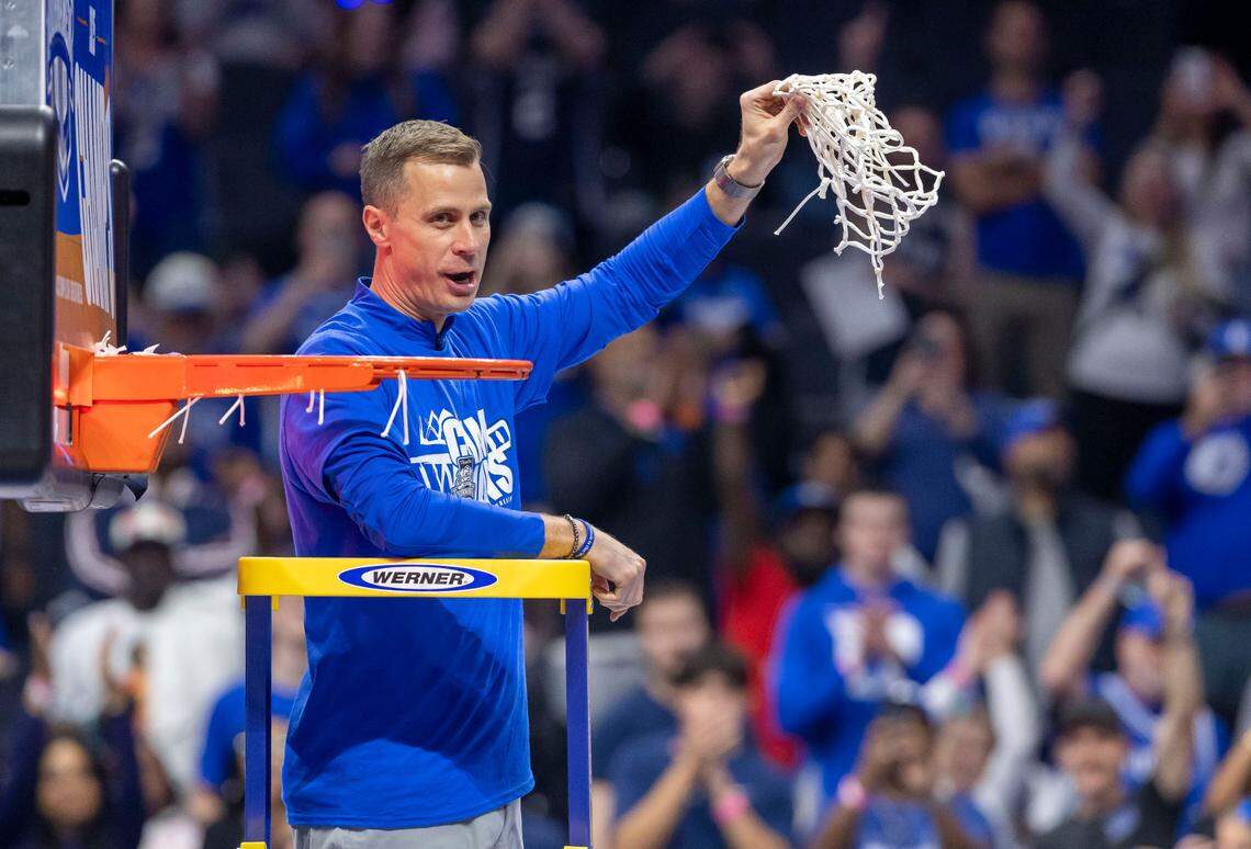 Duke coach Jon Scheyer cuts down the net following the Blue Devils’ 73-62 victory over Louisville in the ACC Tournament Championship game on Saturday, March 15, 2025 at Spectrum Center in Charlotte, N.C.
