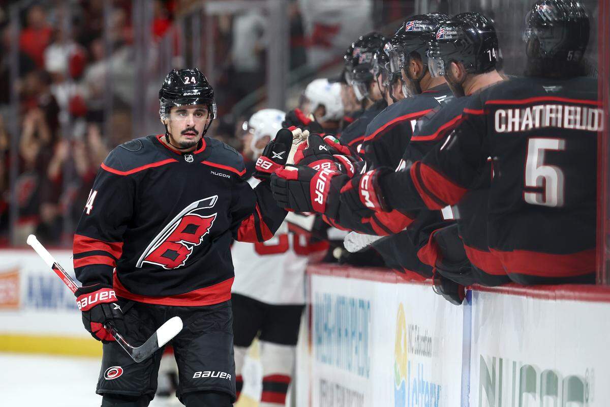 Seth Jarvis of the Carolina Hurricanes reacts after scoring a goal during the third period of the game against the New Jersey Devils at Lenovo Center on October 09, 2025 in Raleigh, North Carolina. Jarvis went down injured Thursday against the Islanders after taking two pucks off the left foot.