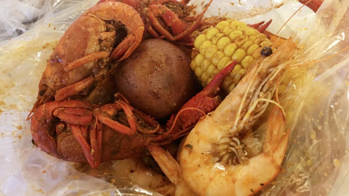 Crawfish with head-on shrimp combo with cajun sauce from Cary Crab House.