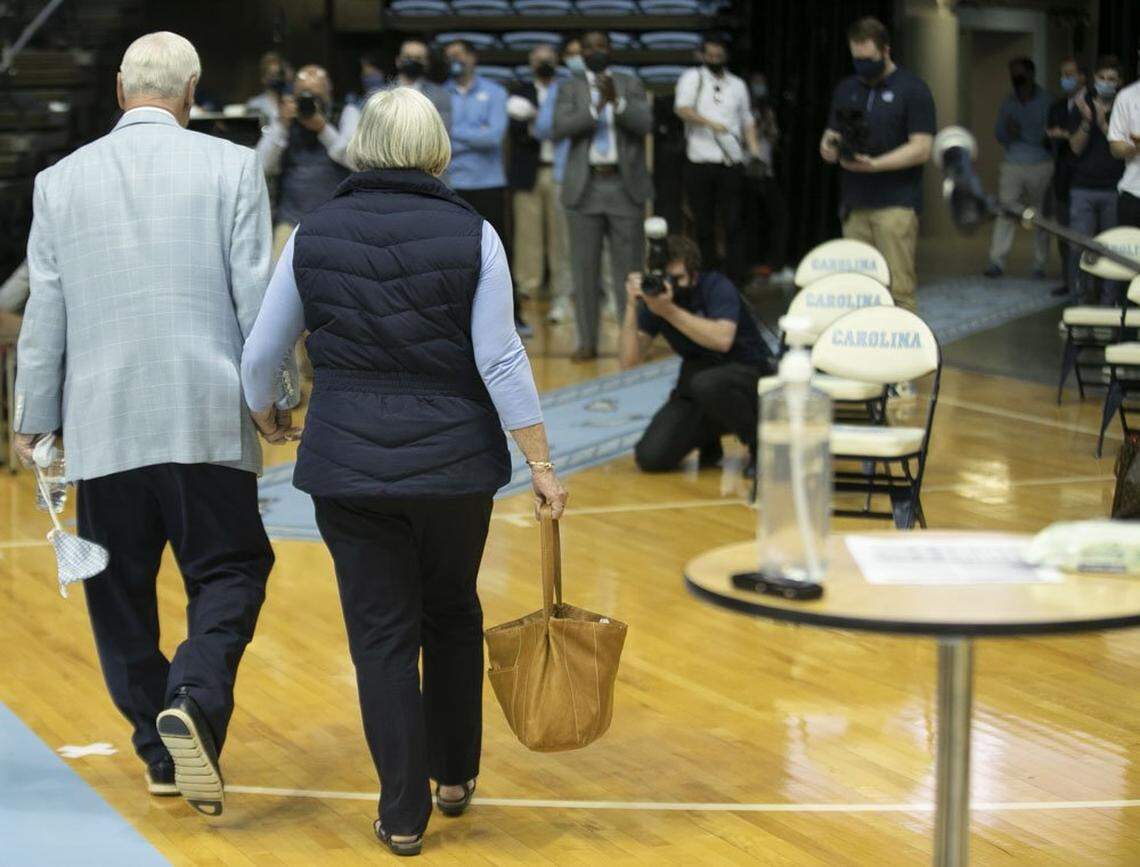 North Carolina coach Roy Williams leaves the Smith Center hand in hand with his wife Wanda, after announcing his retirement from coaching on Thursday, April 1, 2021 at the Smith Center in Chapel Hill, N.C. Williams has coached for 33 seasons, the last 18 at North Carolina, winning the National Championship in 2005, 2009, and 2017.