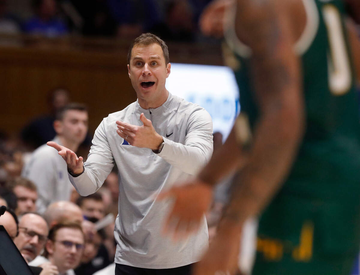 Duke head coach Jon Scheyer motions to an official during the first half of the Blue Devils’ 68-47 win over George Mason on Tuesday, Dec. 17, 2024, at Cameron Indoor Stadium in Durham, N.C.