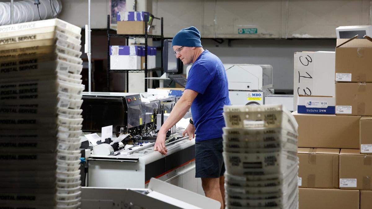 Jesse Davis works in the mailroom in the old DMV building on New Bern Ave. in Raleigh, N.C., on Jan. 3, 2023. More than three years after the N.C. Division of Motor Vehicles moved its headquarters from Raleigh to Rocky Mount, seven employees still work in the agency’s mailroom, which handles more than 20 million pieces a year.