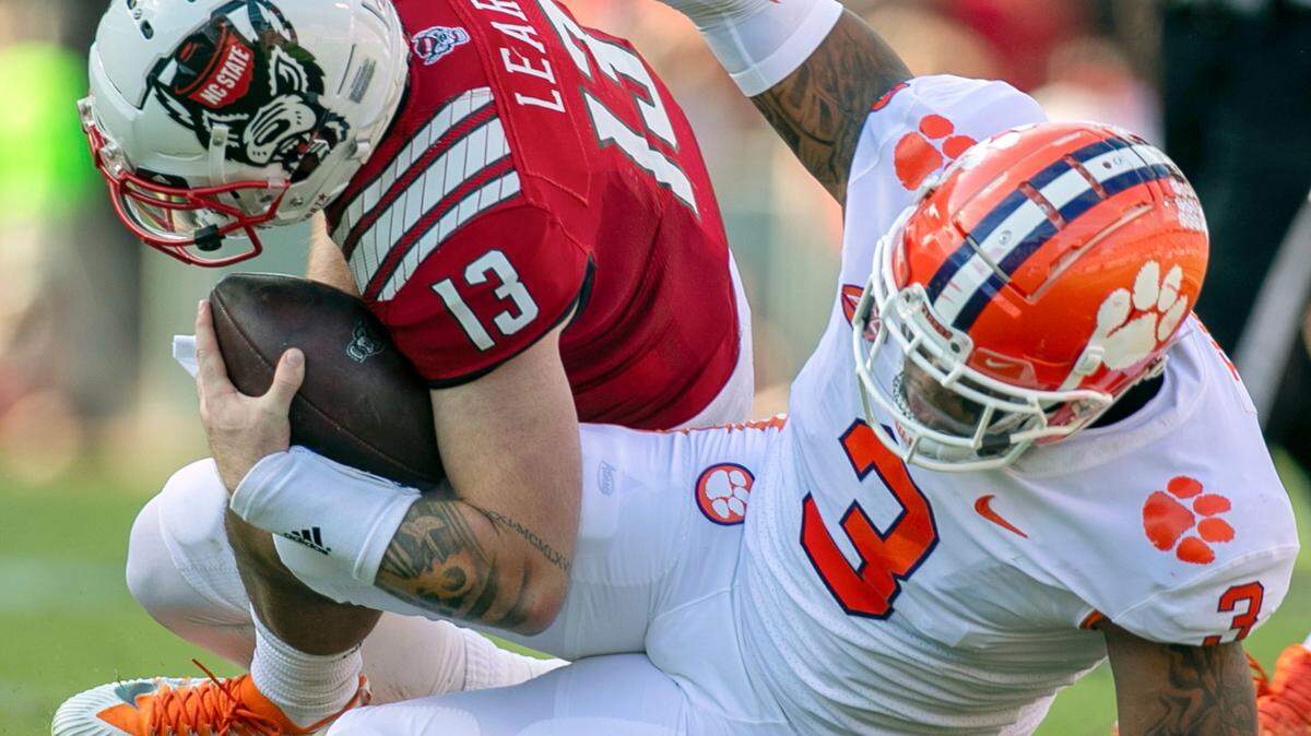Clemson’s Xavier Thomas (3) sacks N.C. State quarterback Devin Leary (13) in the second quarter for an eight yard loss on Saturday September 25, 2021 at Carter-Finley Stadium in Raleigh, N.C.