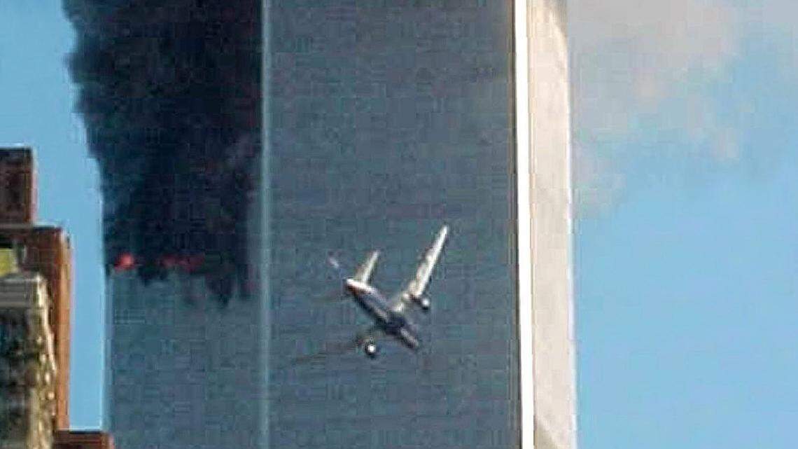 In this Sept. 11, 2001 file photo, American Airlines Flight 175 closes in on World Trade Center Tower 2 in New York, just before impact.
